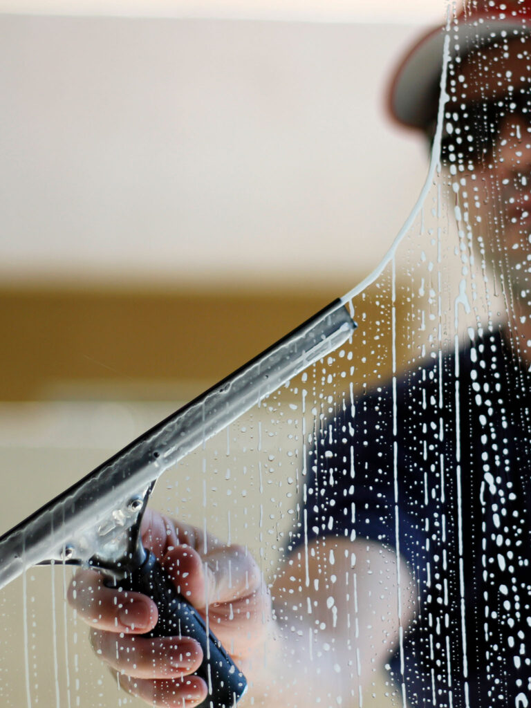 a man cleaning a window